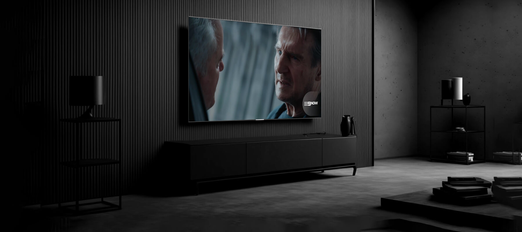 A wall-mounted TV playing 9Now BVOD in a dark lounge — connected TV.